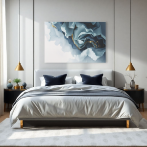 A bedroom with a white bed and a canvas print featuring fluid waves of blue and gold hues.