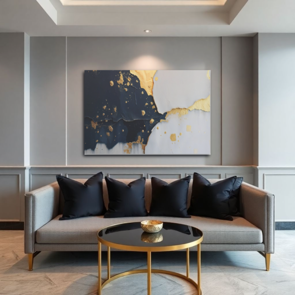 A living room with a gray sofa and a canvas print featuring an abstract design with gold accents and a textured, layered effect.
