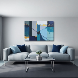 Canvas art featuring blue, teal, and gold abstract geometric painting with textured blocks and lines, displayed above a gray sofa in a modern living room.