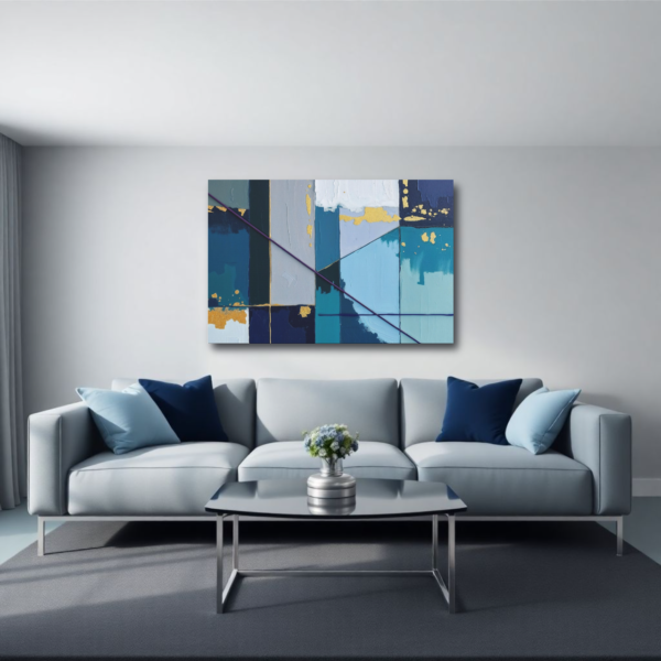 Canvas art featuring blue, teal, and gold abstract geometric painting with textured blocks and lines, displayed above a gray sofa in a modern living room.