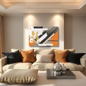 A living room with a beige sofa and a canvas print featuring an abstract geometric design with black, white, orange, and gold leaf accents.