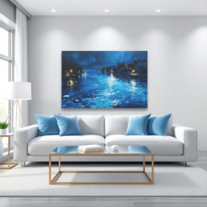A living room with a white sofa and a canvas print featuring a night river scene with reflections of lights on blue water.
