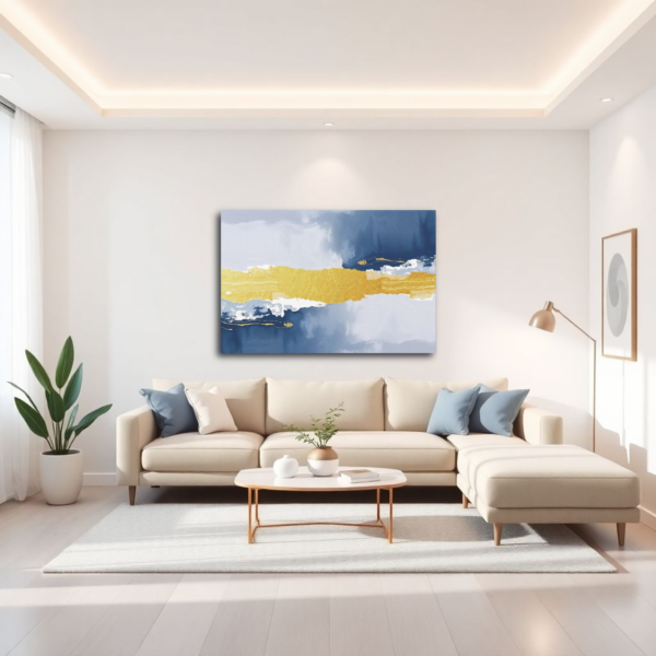 Abstract painting with a horizontal gold band, flanked by blue and white, displayed above a beige sectional sofa in a bright living room.