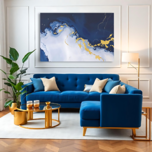 A modern living room with a blue sofa and a large canvas print featuring an abstract design with blue, white, and gold.