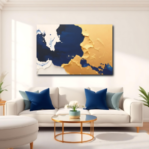 A living room with a white sofa and a canvas print featuring a dynamic abstract design with blue splashes and gold patterns.