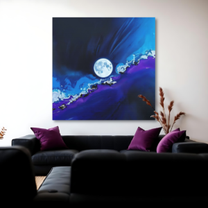 Canvas art featuring a mystical moon and nebula scene with luminous details, displayed above a black sofa in a modern living room.